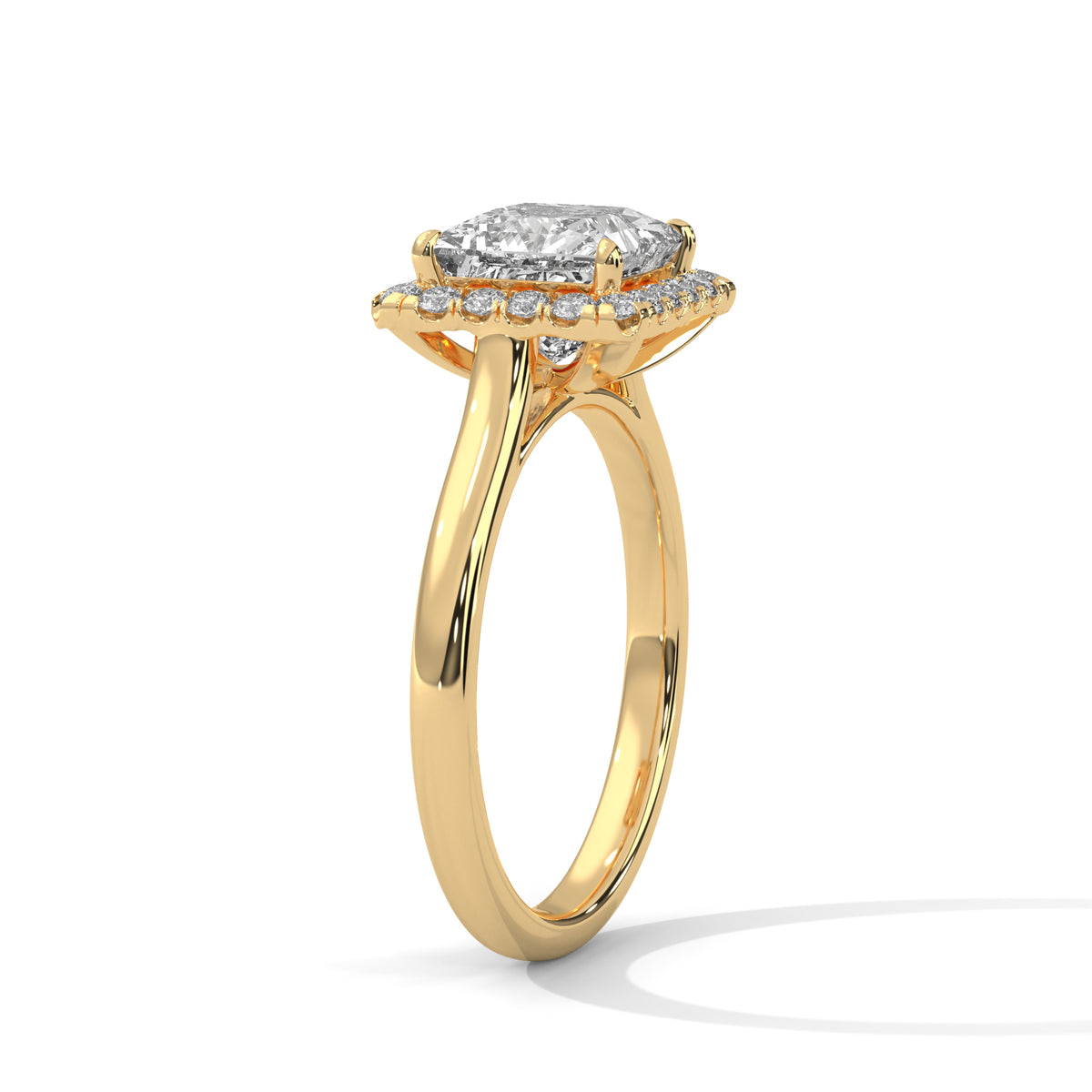 Gold ring with a diamond halo on a white background
