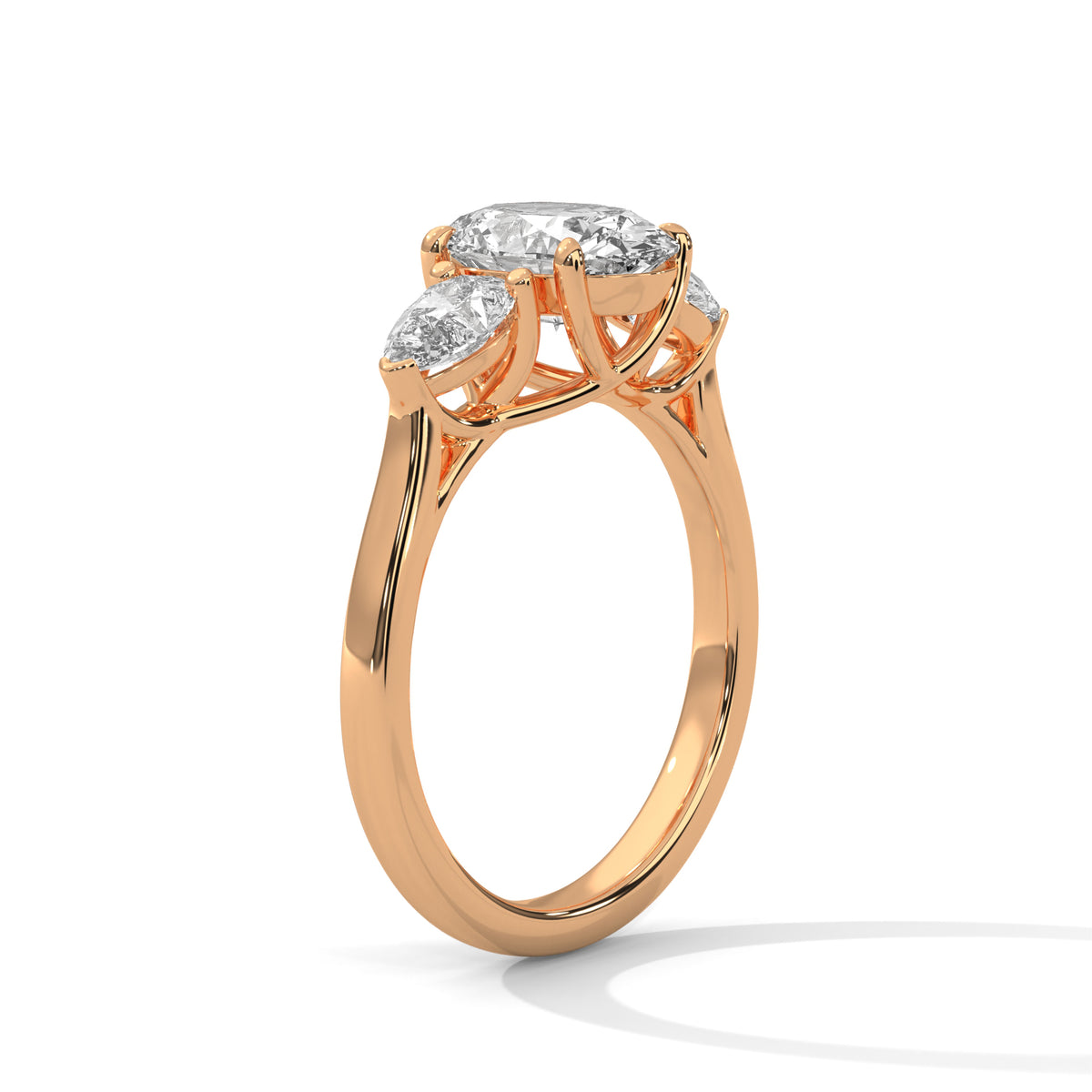 Rose gold ring with three diamonds on a white background