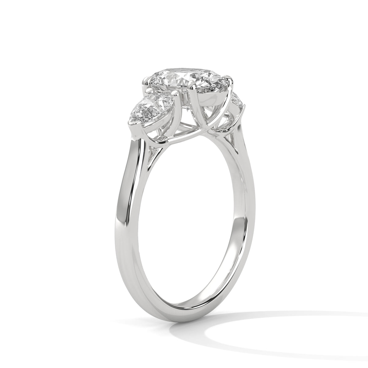 Silver ring with three heart-shaped gemstones on a white background