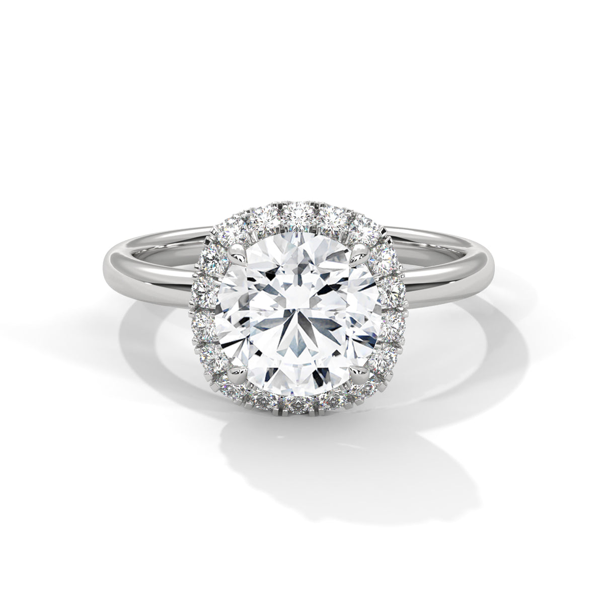 Diamond ring with a halo on a white background