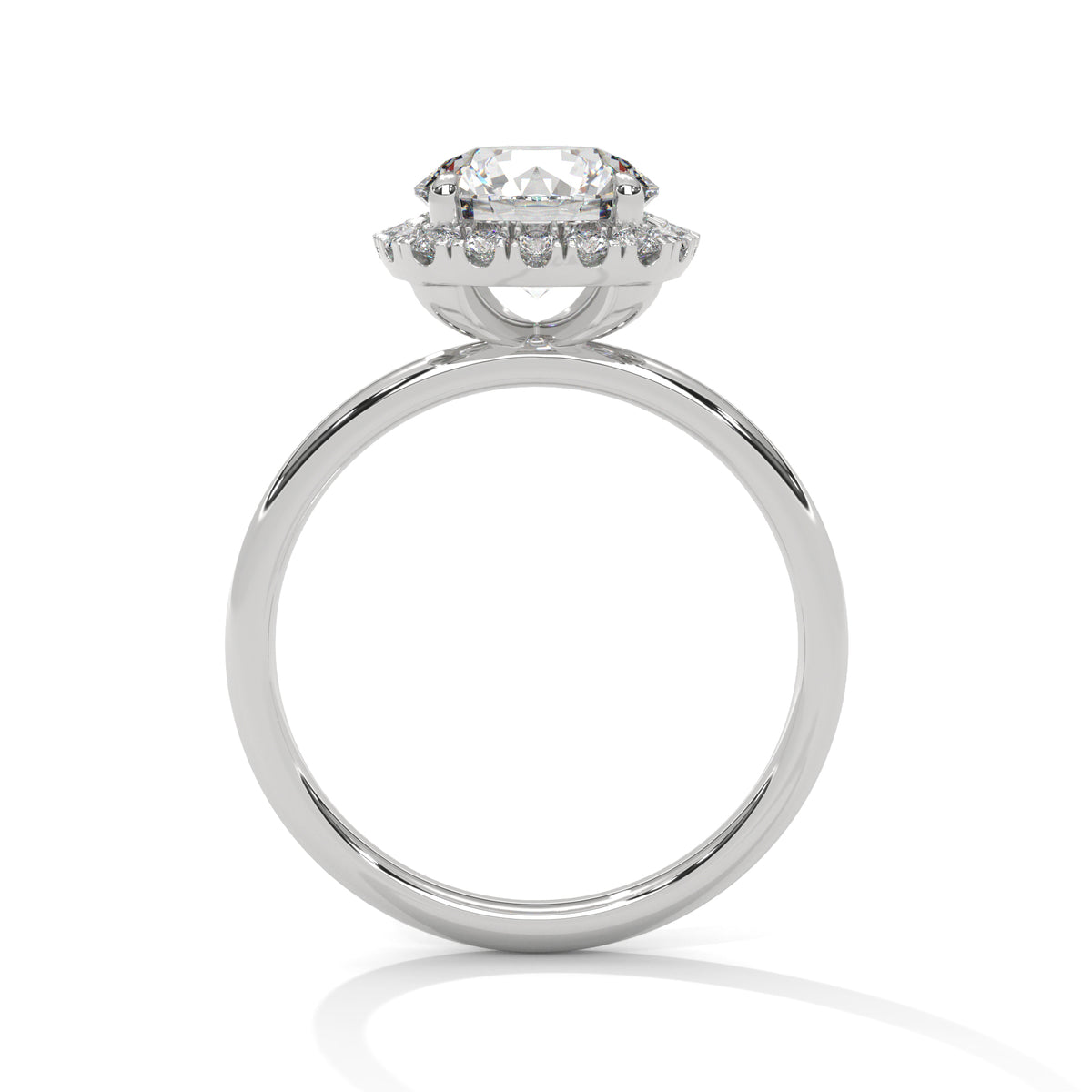Diamond ring with a halo setting on a white background