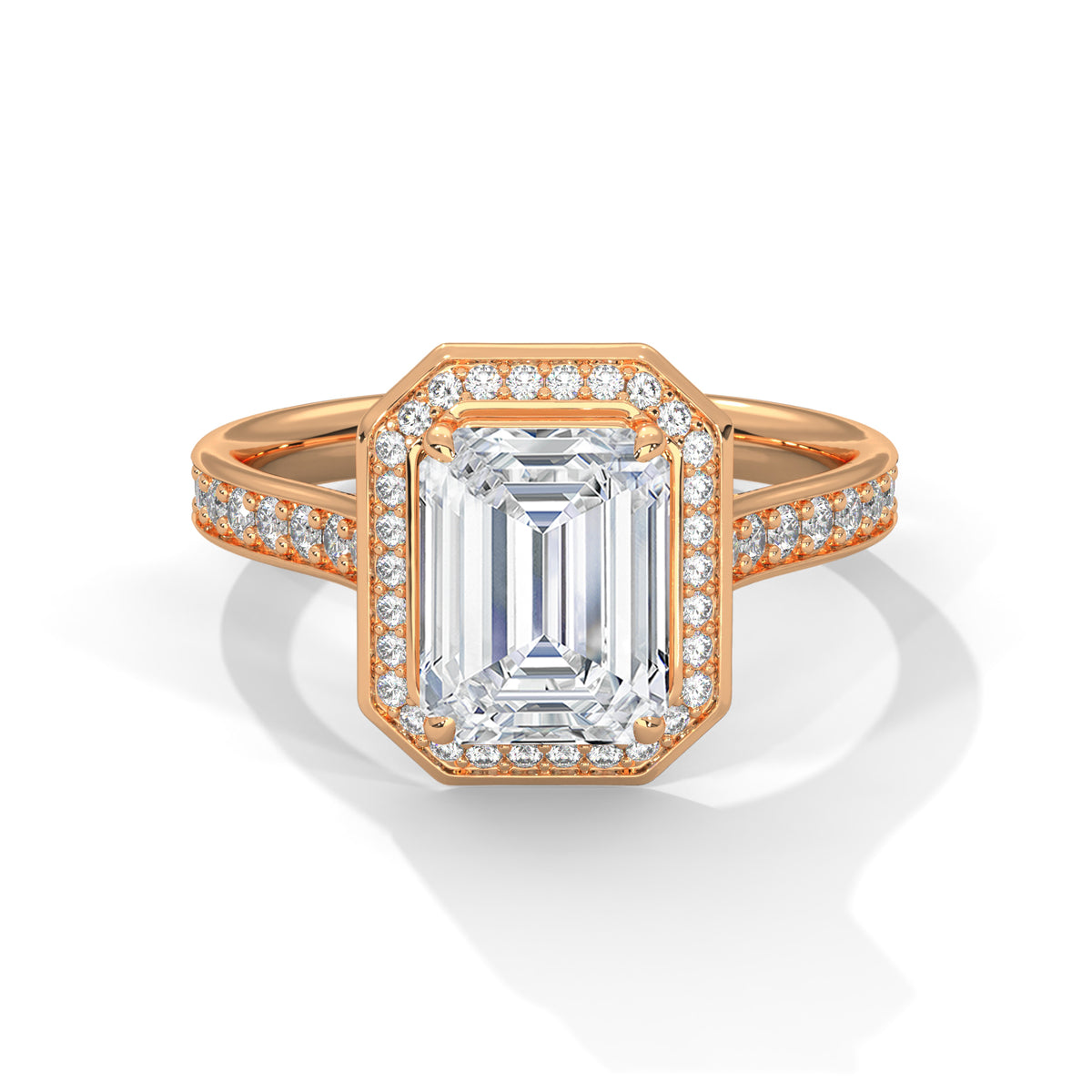 Rose gold ring with emerald-cut diamond and smaller diamonds on a white background