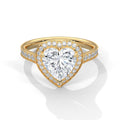 Heart-shaped diamond ring with gold band on a white background