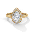 Gold ring with a pear-shaped diamond and smaller diamonds on a white background