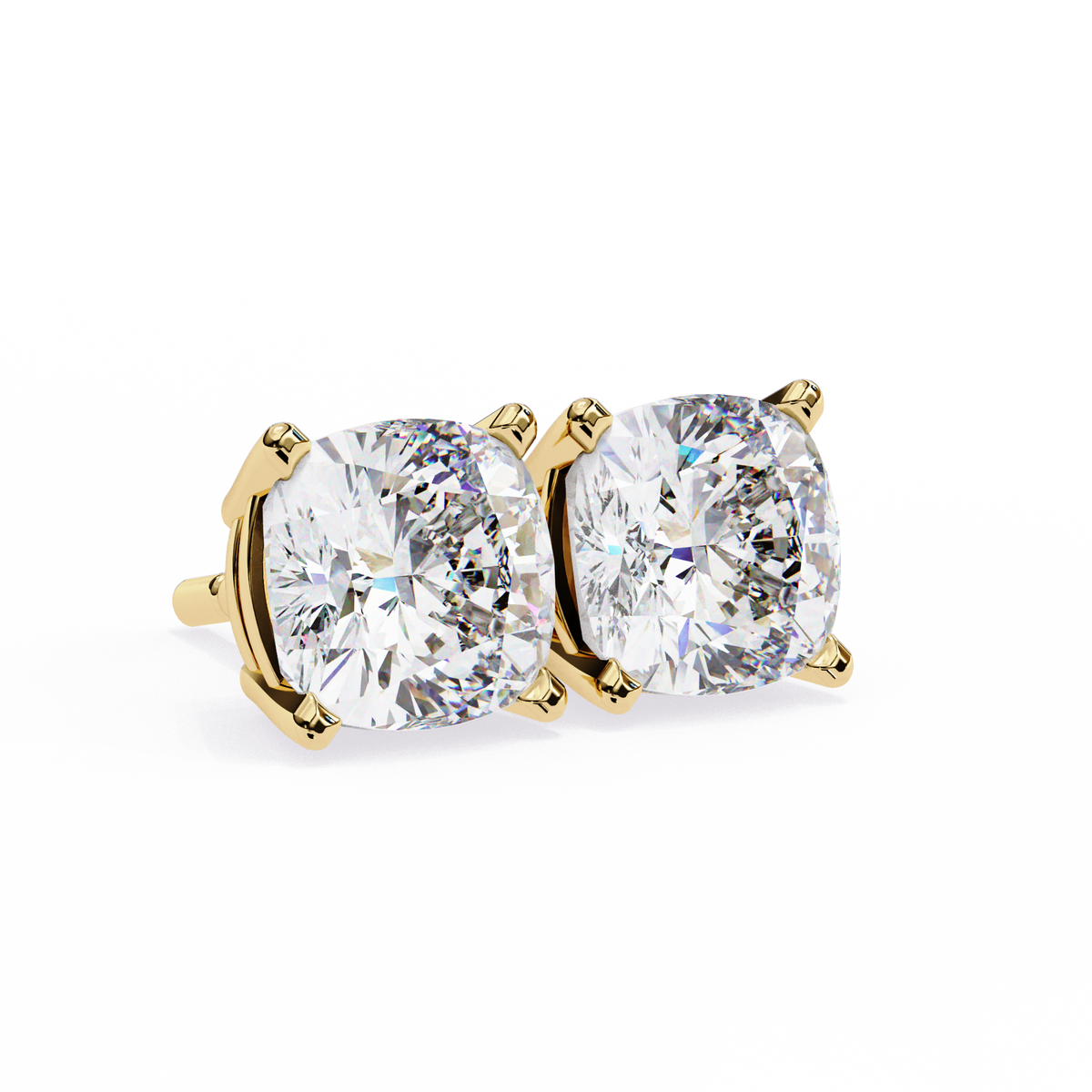 Gold earrings with large clear gemstones on a white background