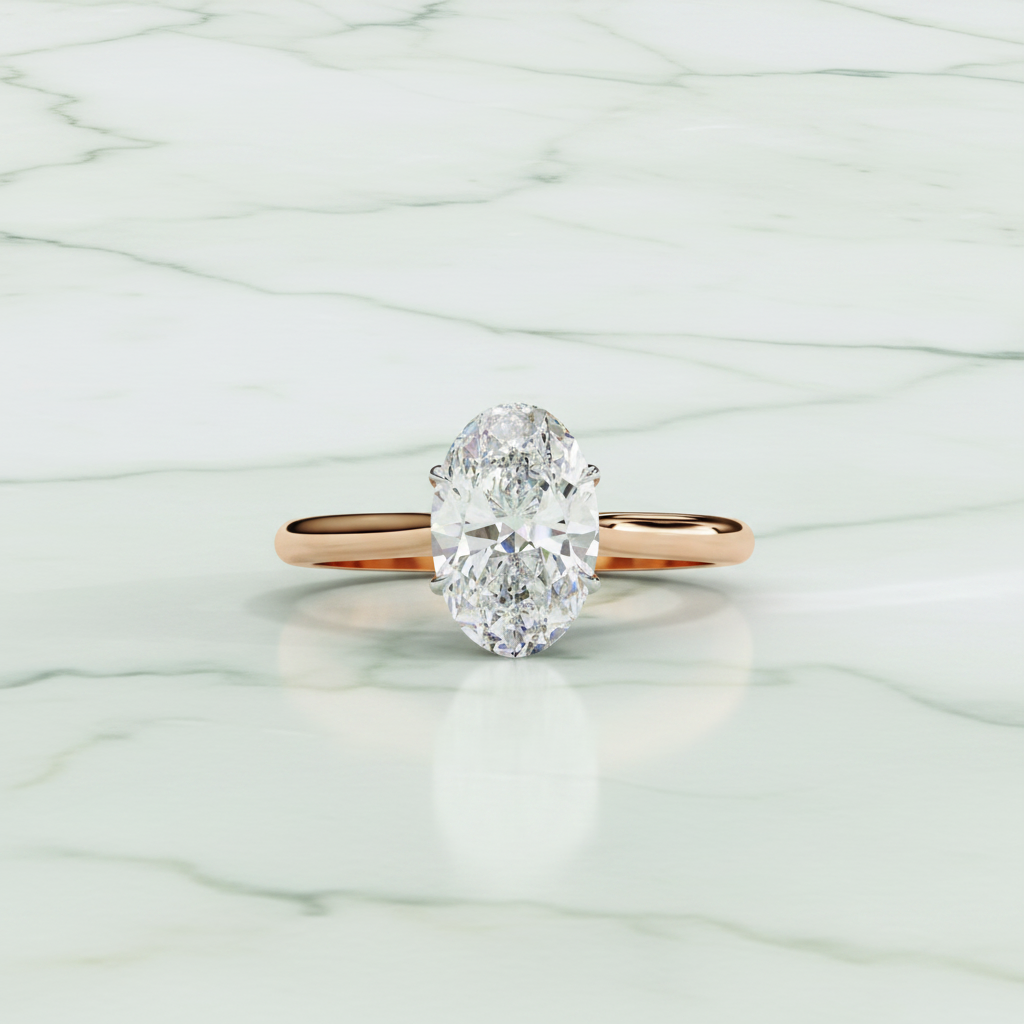 Rose gold ring with two large diamonds on a white background