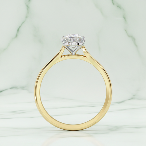 Gold ring with a diamond on a white background
