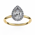 Gold ring with a pear-shaped diamond and halo on a white background