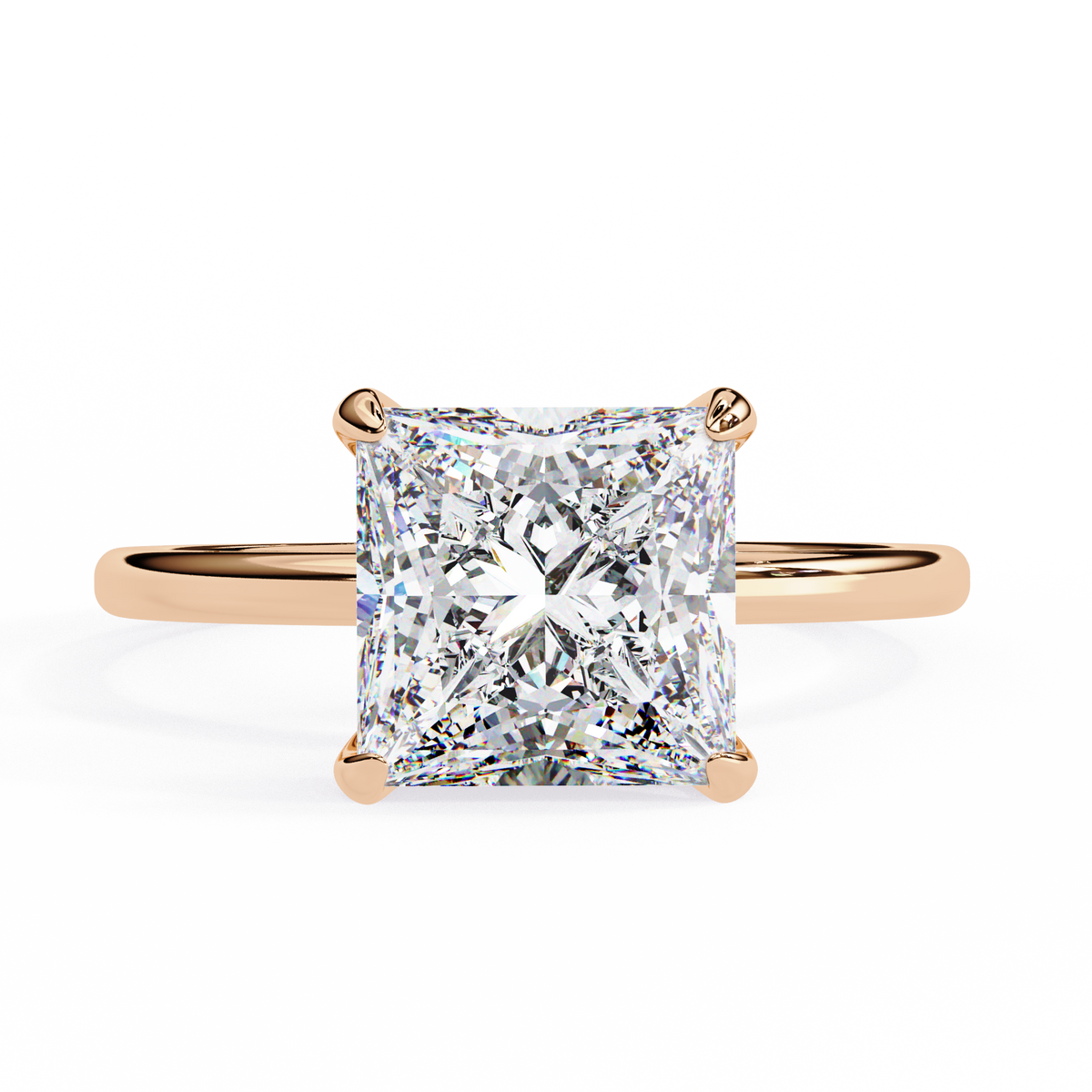 Rose gold ring with a large diamond on a white background