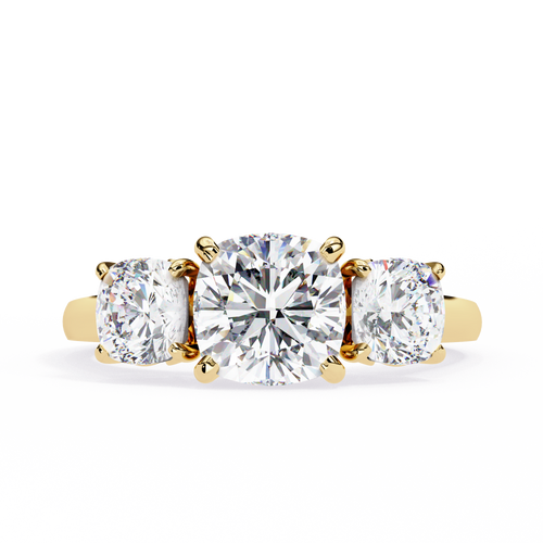 Three-stone diamond ring with gold setting on a white background