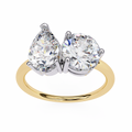 Gold ring with two large clear gemstones on a white background