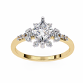 Gold ring with a large diamond and smaller diamonds on a white background