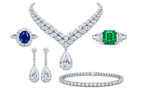 Luxury jewelry set with necklace, earrings, ring, and bracelet on a white background