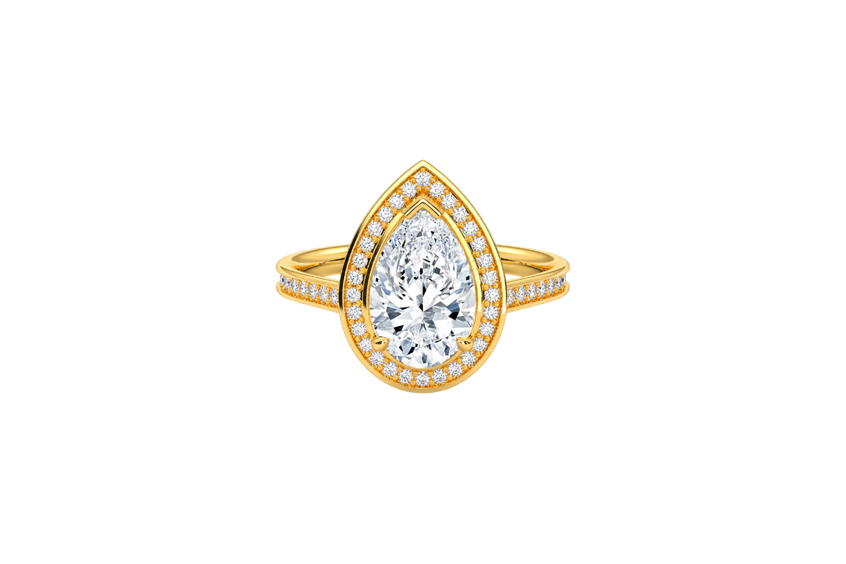 A yellow gold ring featuring a large pear-cut diamond center stone surrounded by a halo of smaller round diamonds, with a split shank also paved with diamonds, shown on a plain white background.