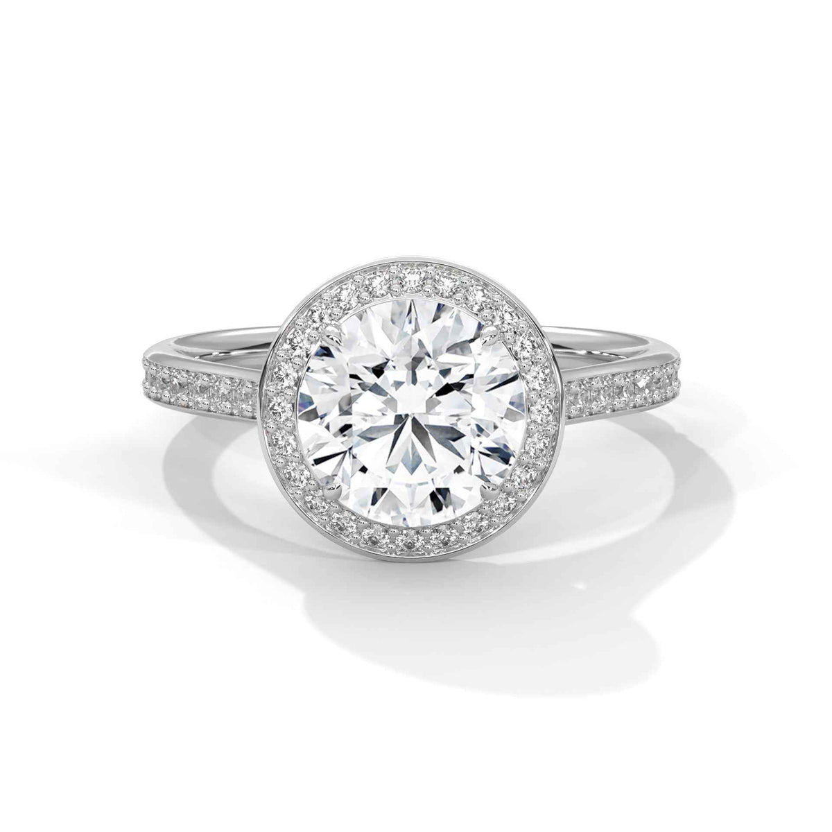 Diamond ring with a white gemstone and silver band on a white background