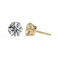 Gold stud earrings with clear gemstones on a white background