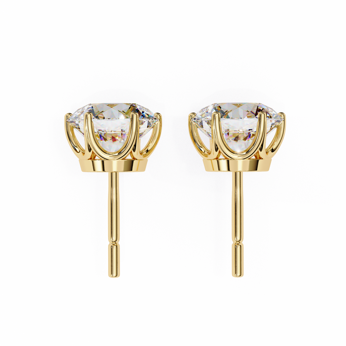 Gold earrings with clear gemstones on a white background