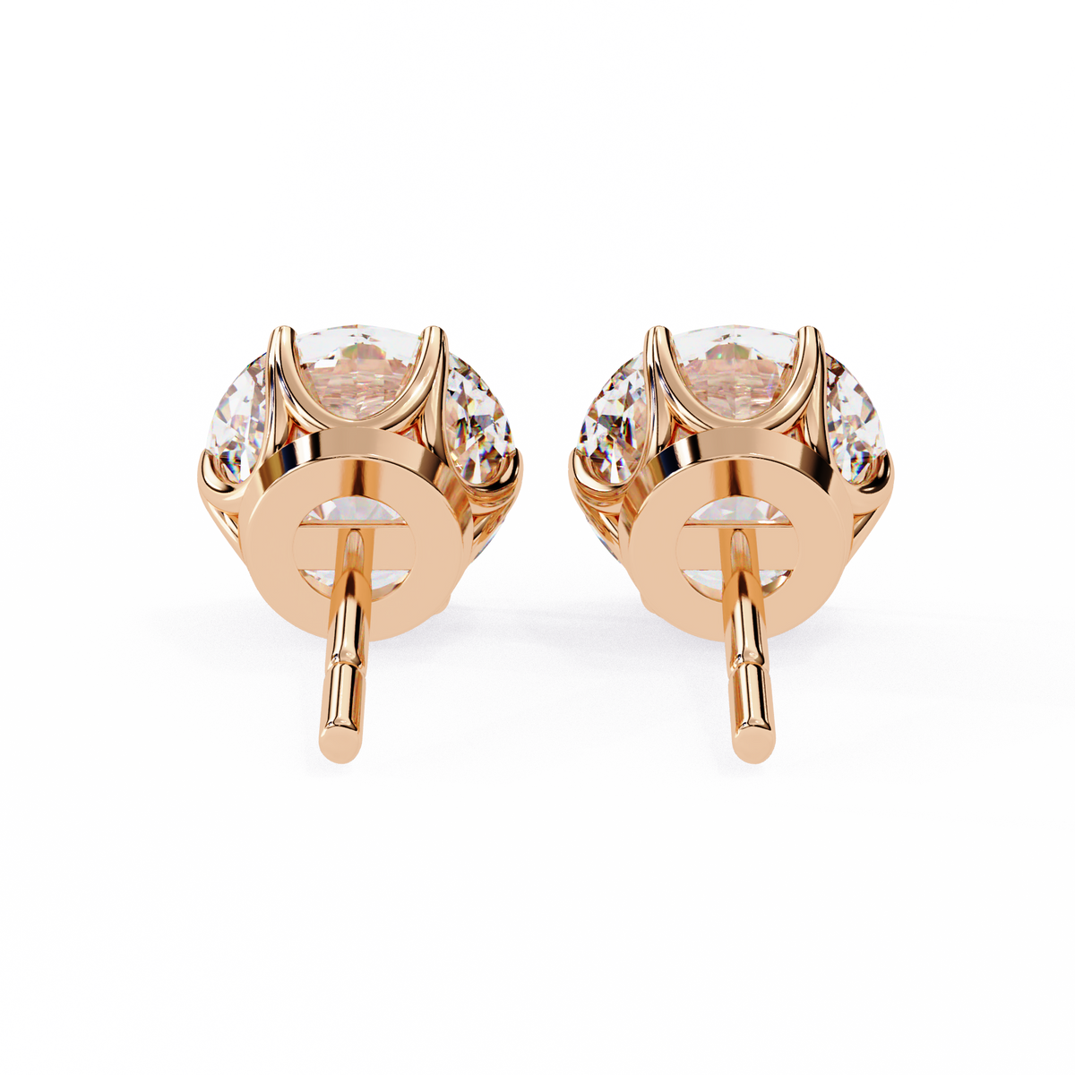 Rose gold earrings with clear gemstones on a white background