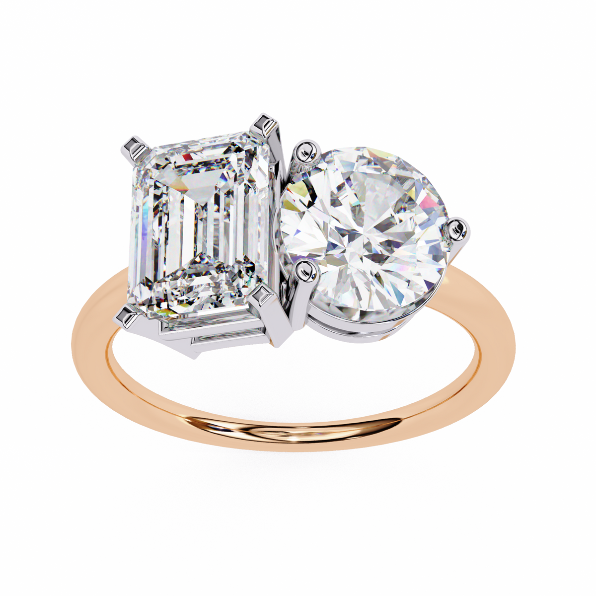 Two-stone diamond ring with emerald-cut and round-cut diamonds on a white background