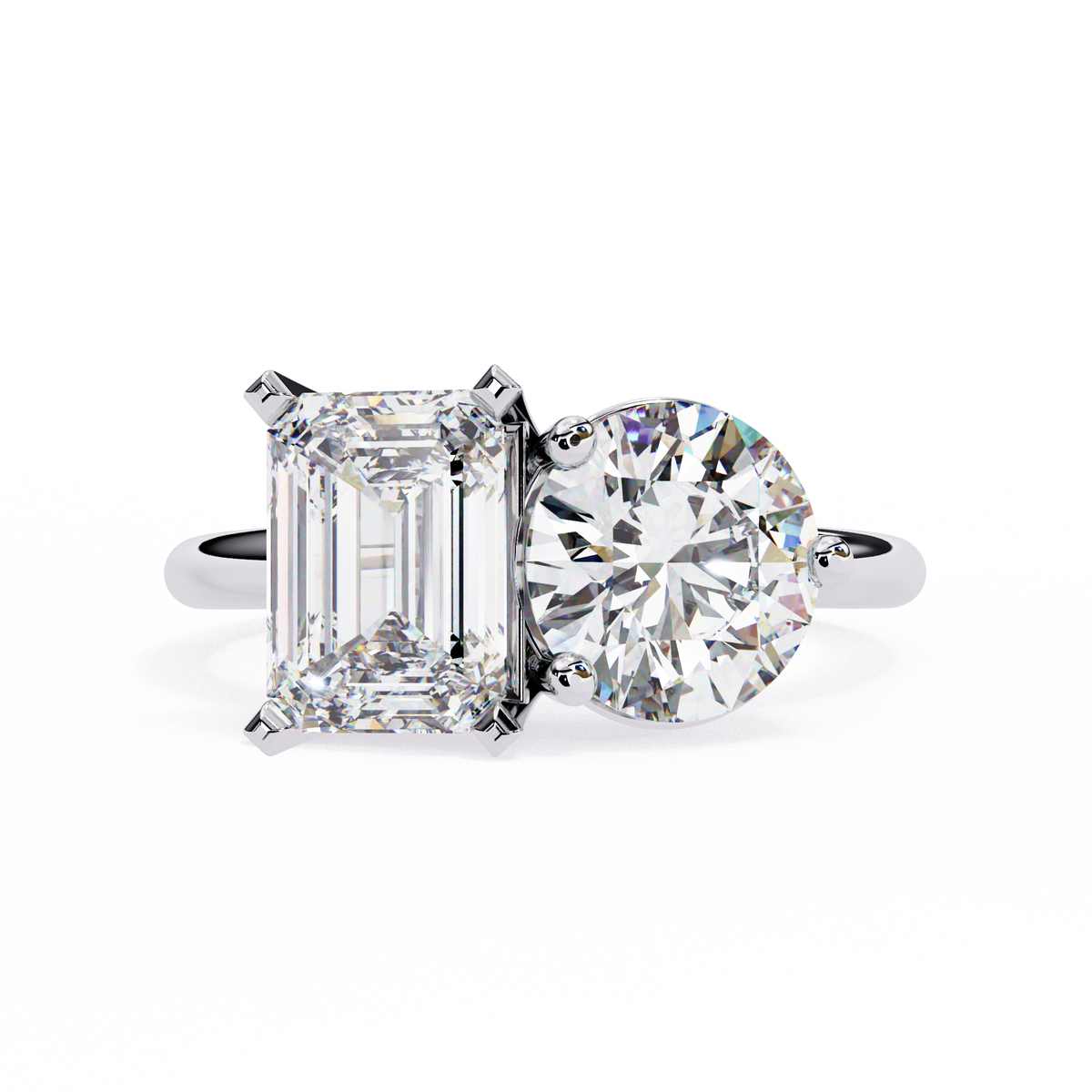 Diamond ring with emerald-cut and round-cut diamonds on a white background